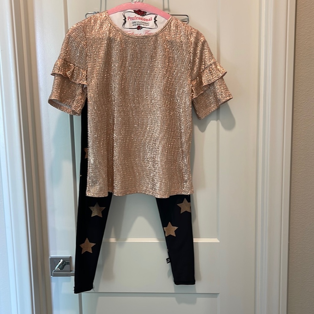 Girls rose gold sparkle top with ruffled sleeve.